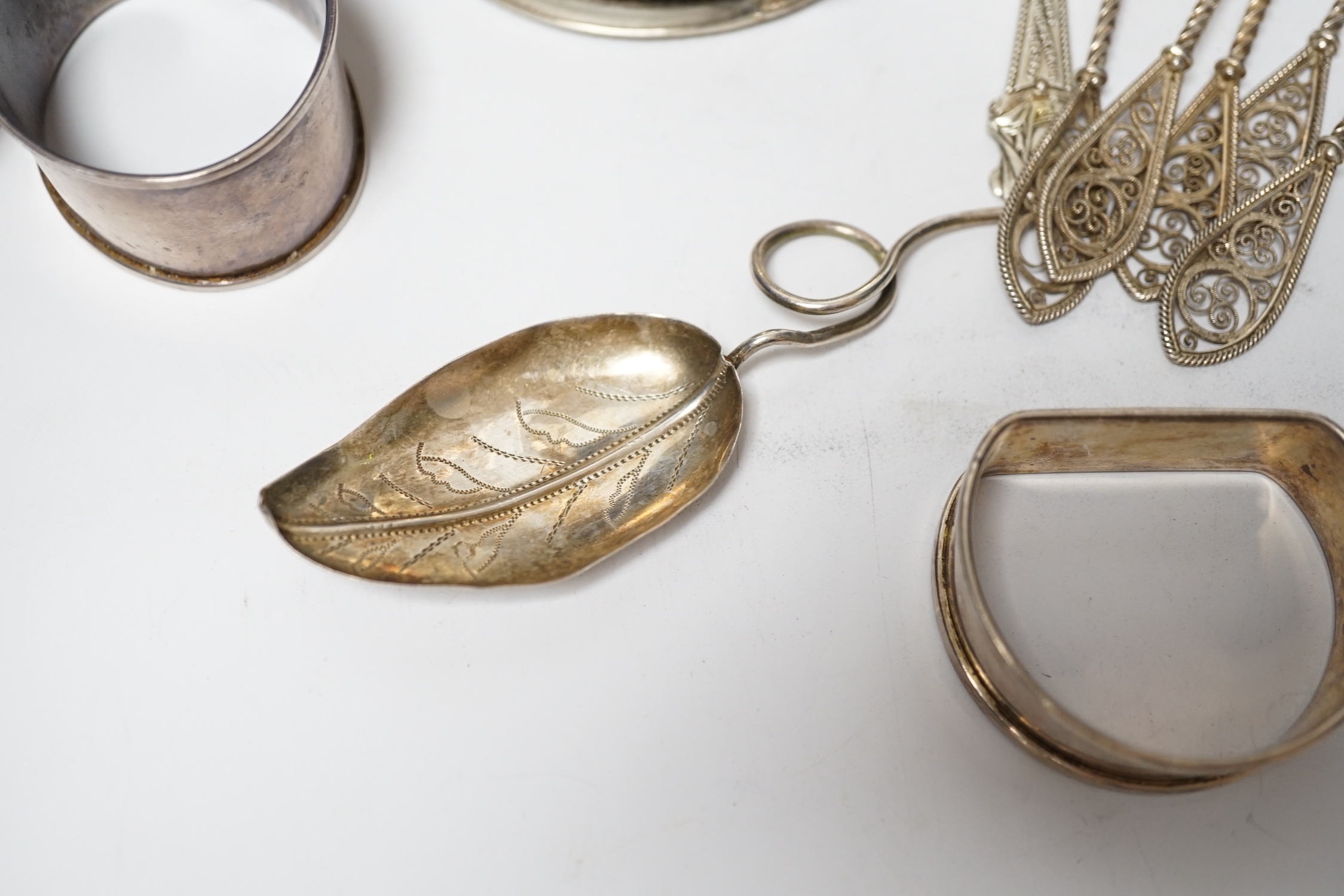 A silver sugar caster, serviette rings, a plated wine funnel, a Wedgwood biscuit barrel, etc.